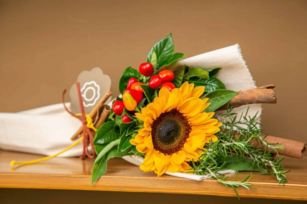 Buquê de flores com girassol e cravo